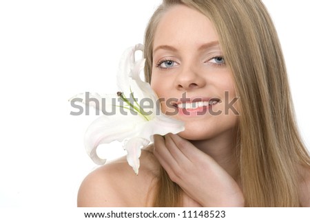 Studio portrait of a girl with madonna lily on a white background