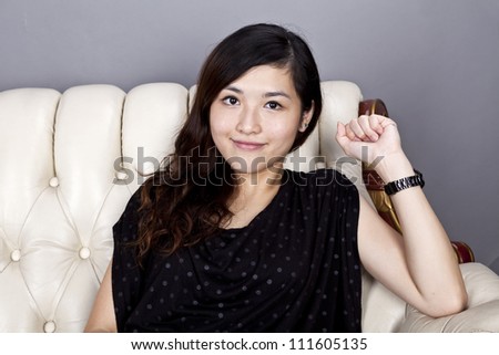 Asian woman relax on sofa