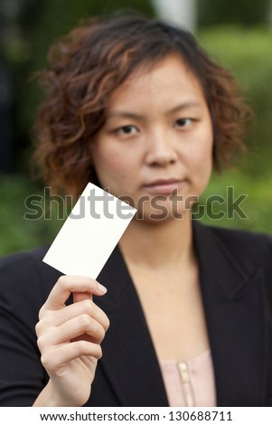 Business woman holding a name card