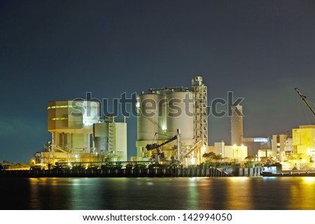 Oil tanks at night in gas factory
