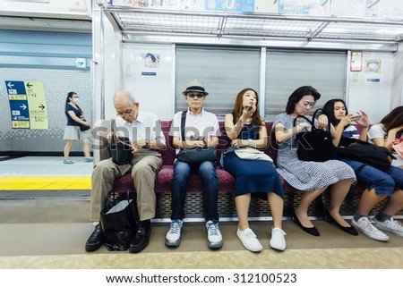 TOKYO - AUG 1: Interior of metro at August 1, 2015 in Tokyo, Japan. Tokyo railway is one of the busiest transportation system in the world.