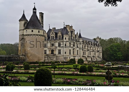 CHENONCEAUX, FRANCE -APRIL 25: On April 25, 2012 visitors brave the elements to visit Chateau Chenonceau. Chenonceau is a manor house built on the site of an old mill located on the River Cher in Chenonceaux, France.