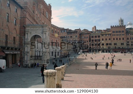 SIENA, ITALY--MARCH 19--Locals enjoy lunch in the Piazza del Campo of Siena on March 19, 2008.  Siena is Italy\'s most visited tourist attractions.