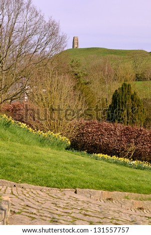 View of Glastonbury Tor from the Chalice Well garden in Glastonbury, England