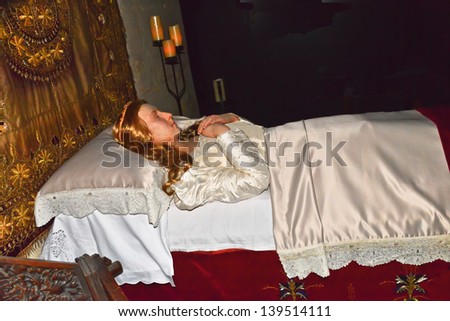 WINCHOMBE, ENGLAND-APRIL 2: A likeness of Catherine Parr, one of the wives of Henry VIII, lies in  Sudley Castle on April 2, 2013. Sudley is one of the few castles that is still a residence.