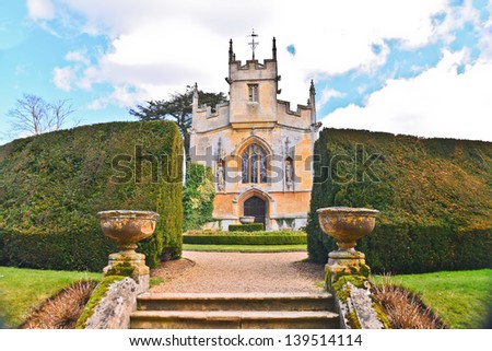 WINCHOMBE, ENGLAND-APRIL 2: A view of the gardens and exterior of St Mary's Chapel of Sudley Castle on April 2, 2013. Sudley is one of the few castles in England that is still a residence.