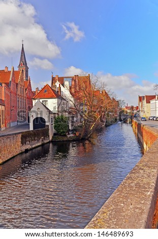 BRUGES, BELGIUM-APRIL 18: One of the canals of Bruges on April 18, 2013. Bruges has a significant economic importance thanks to its port. At one time, it was the \