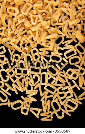 Alphabet soup letters pasta. Children\'s food background.