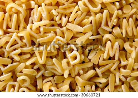 Kids soup letters pasta. Italian food background.