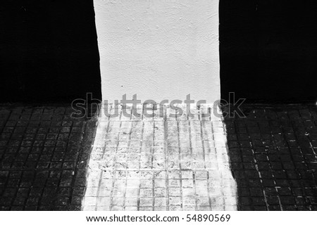 black and white urban backgrounds. stock photo : Wall and sidewalk painted black and white. Urban background.
