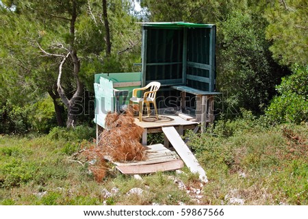 Elevated bird hunting blind in a forest.
