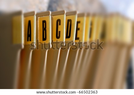 Alphabetical filing tray index office documents organizer. Selective focus.