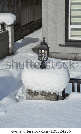 Street light in snow. Small architecture form.