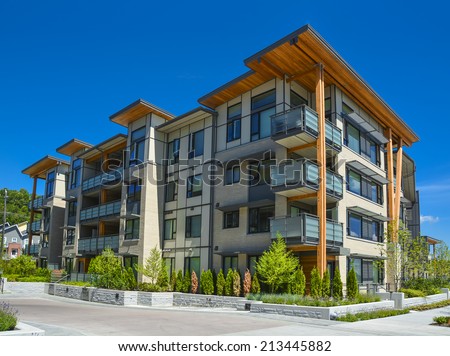 stock-photo-brand-new-apartment-building-on-sunny-day-in-british-columbia-canada-213445882.jpg