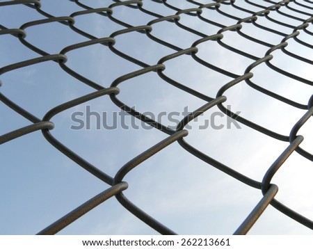 wired mesh fence in sky background