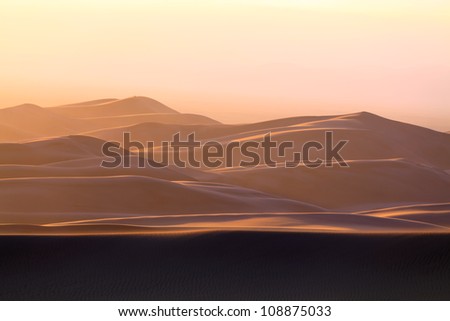 Sand Dunes of Colorado in Sandstorm\
Depiction of the mystery of the winds and sand. The story written one day and changed by the next. Elusiveness illuminated just before the light flickers out.
