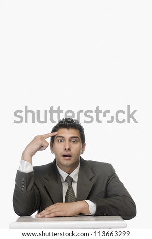 Portrait of a businessman thinking with his eyes wide open