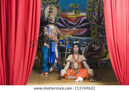 Two actors dressed-up as Rama and Ravana the Hindu mythological characters