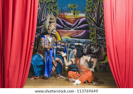 Two actors dressed-up as Rama and Ravana the Hindu mythological characters