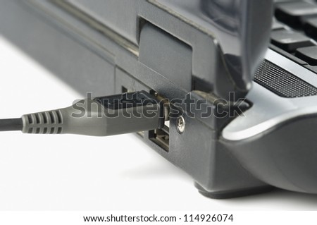 USB cable connected on USB port of a laptop
