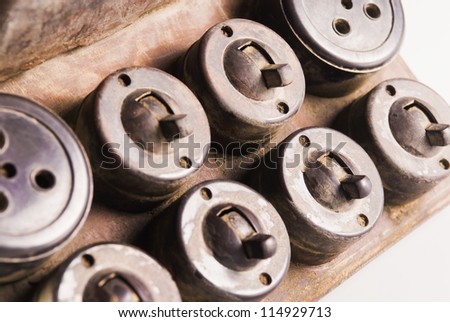 Close-up of an aged light-switches and sockets