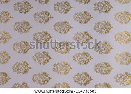 Close-up of flower pattern on a light purple paper background