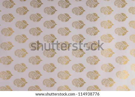 Close-up of flower pattern on a light purple paper background