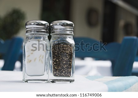 Salt shaker and a pepper shaker on a table, Athens, Greece