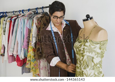 Tailor working in a clothing store