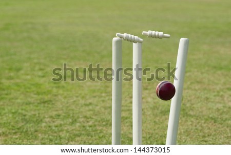Cricket ball hitting stumps