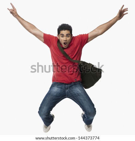 University student jumping in excitement