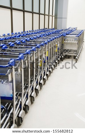 Row of luggage carts in airport, Kerala, India