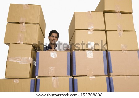 Store manager with cardboard boxes