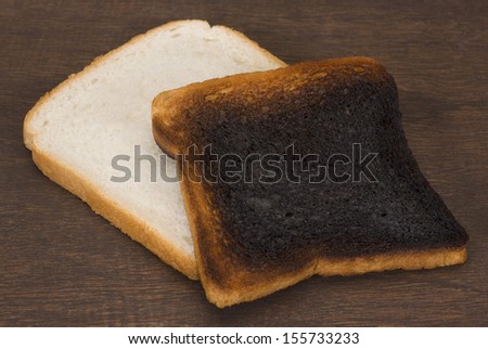 Slice of bread with burnt toast