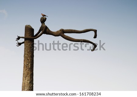 Bird perching on a sculpture, Garden of Five Senses, Saidul Ajaib, New Delhi, India