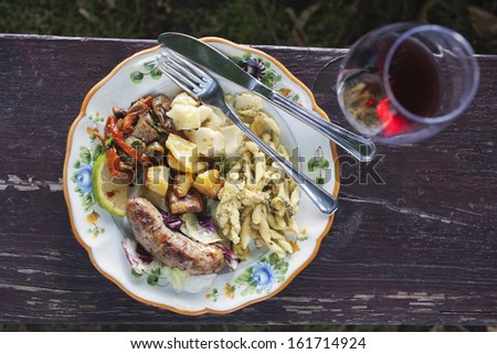 Meal served on a plate with a wineglass, Italy