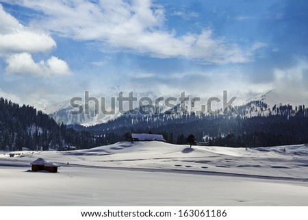Snow covered landscape with mountain range in the background, Kashmir, Jammu And Kashmir, India