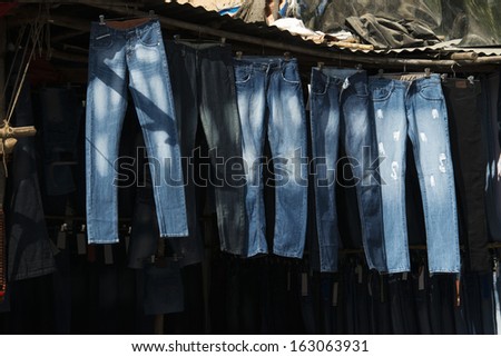 Jeans hanging for sale outside a store, Pushkar, Ajmer, Rajasthan, India