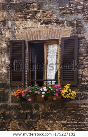 Window boxes on the window of a building, San Gimignano, Siena, Siena Province, Tuscany, Italy