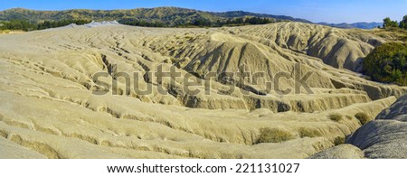 Panorama of cracked soil landscape in sunset light in Mud volcanoes\'area in Buzau County, Romania