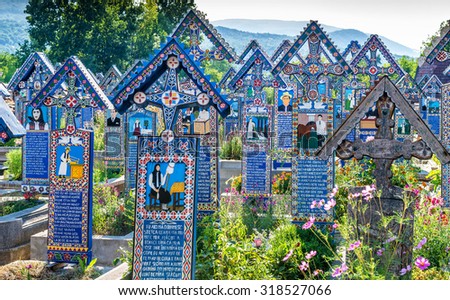 SAPANTA, ROMANIA - AUGUST 10, 2015 - Painted wooden crosses in the famous Merry Cemetery in Maramures, an unique and amusing monument in the entire world