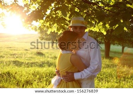 man and woman in sunset in the park