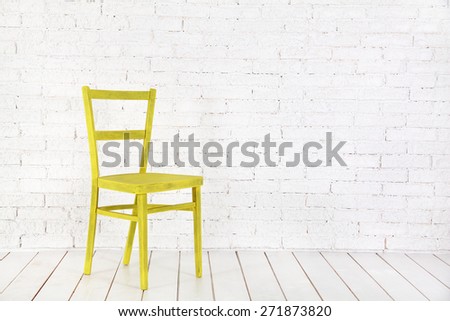 White interior with yellow chair