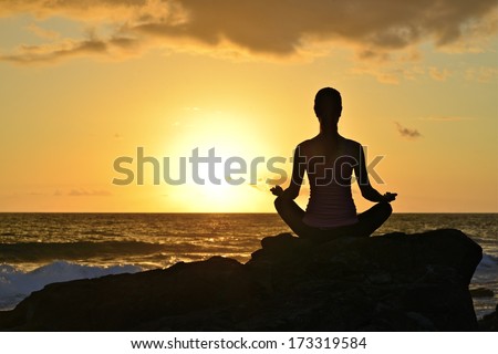 Serenity, Sunrise Meditation pose. Taken at the beach perched on top of some rocks, the figure is in silhouette. 15/12/2013