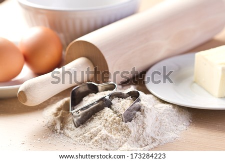 Ingredients for baking cookies and heart shaped cookies cutters