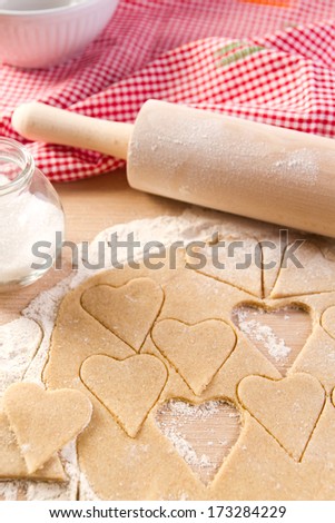 Baking heart shaped cookies,rolling pin,sugar