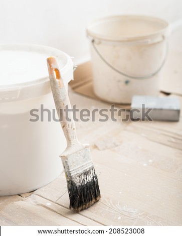 Paint brush  and the paint bucket