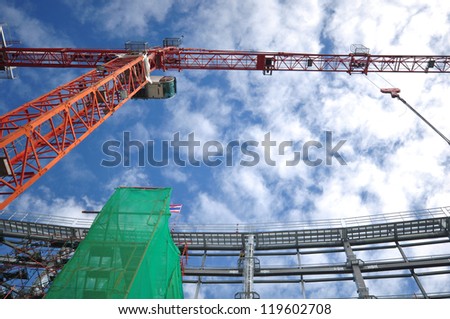 Construction site with worker and tower crane