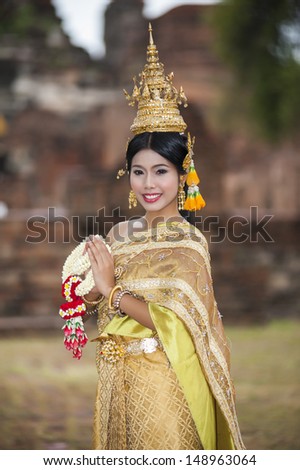 Female in Thailand traditional dress at Ayuthaya historical park