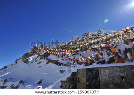 prayer flags at Khadung La pass the road to Nubra Valley from Leh India